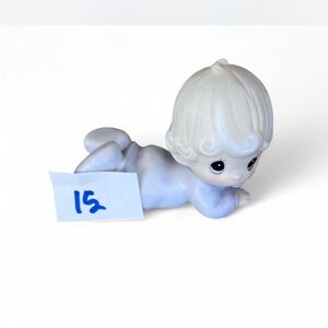 Adorable Precious Moments little girl lying down figurine in excellent condition